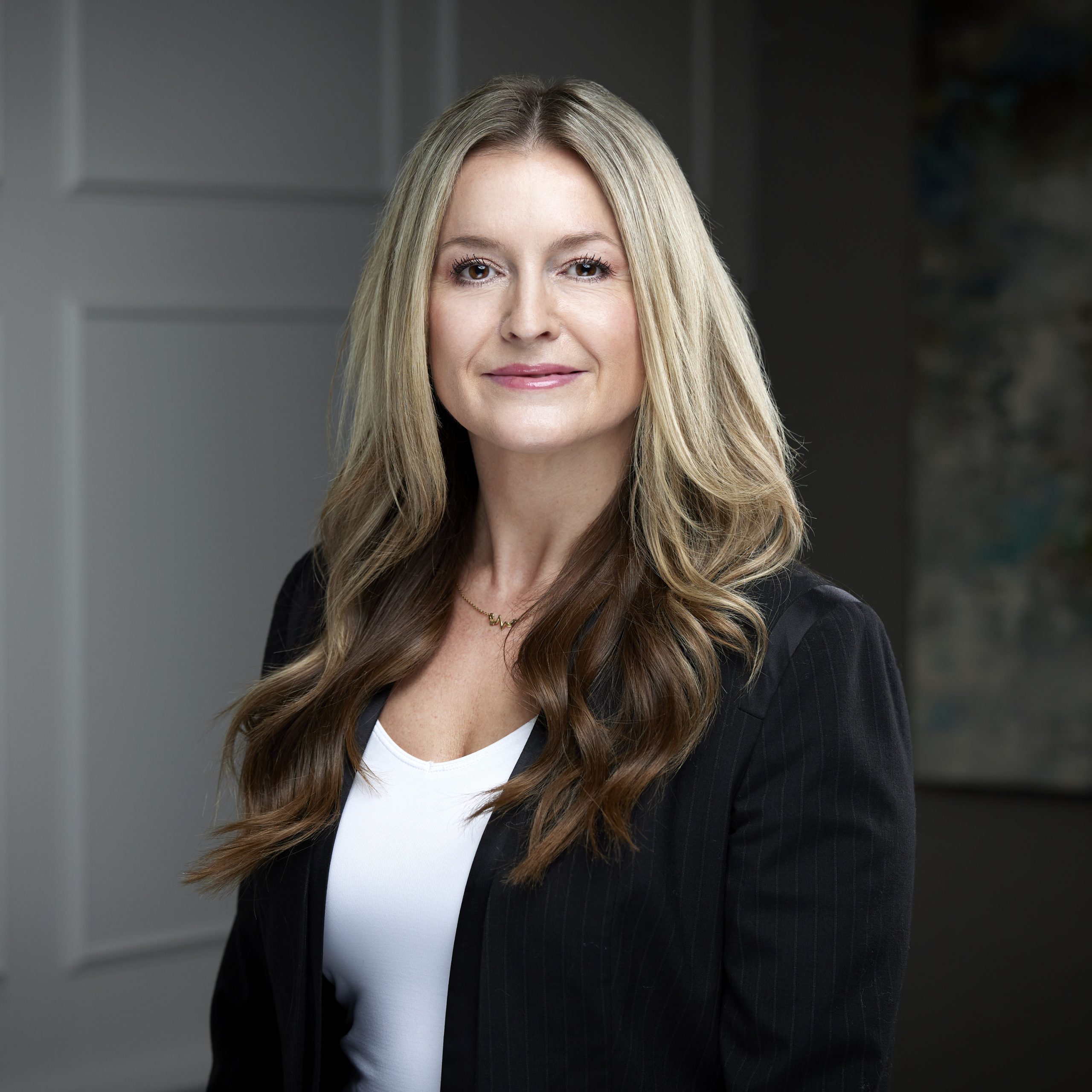 An image of Melissa Stevens in the Niagara Region office of DDL & Co.