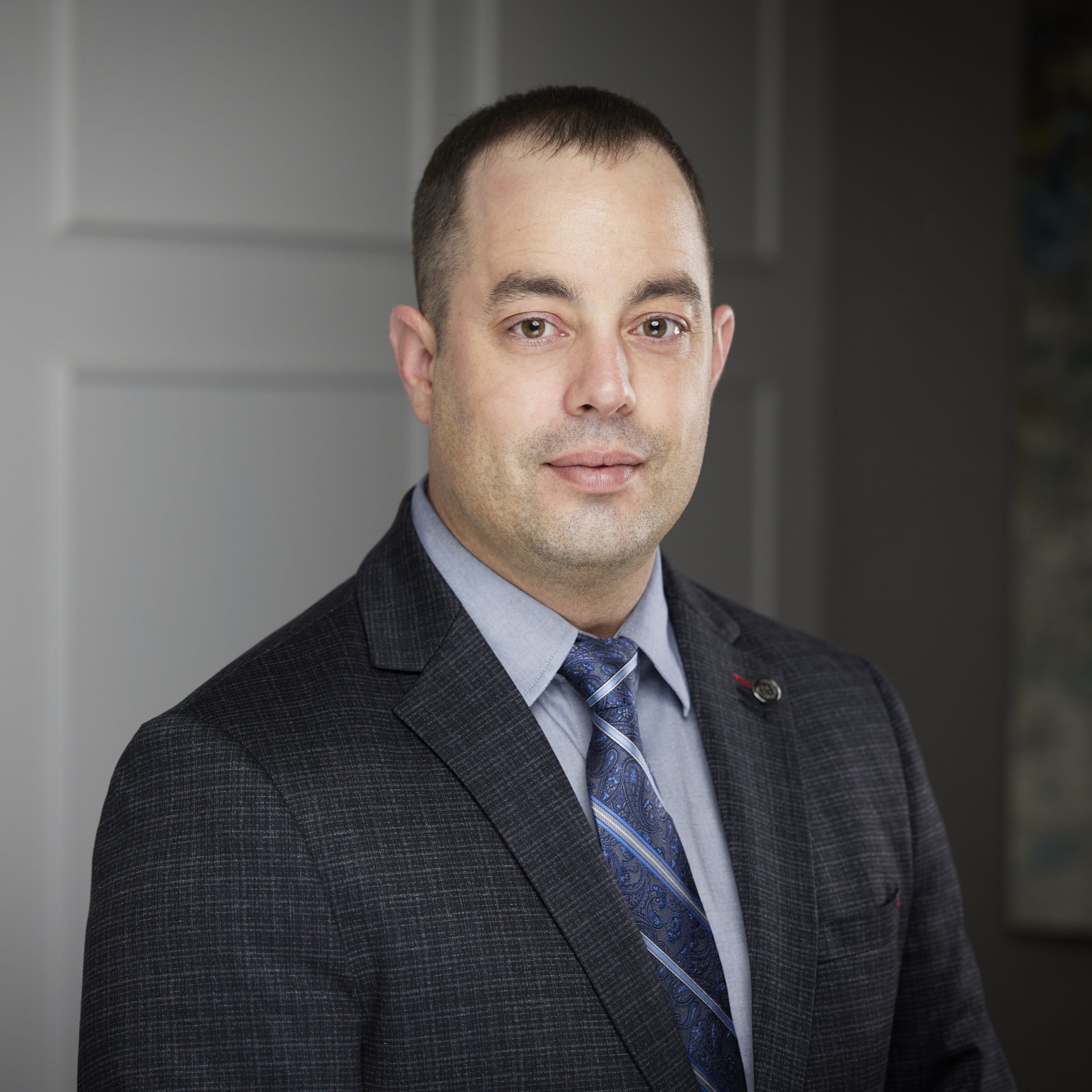 An image of Chris Marino in the St. Catharines office of DDL & Co.