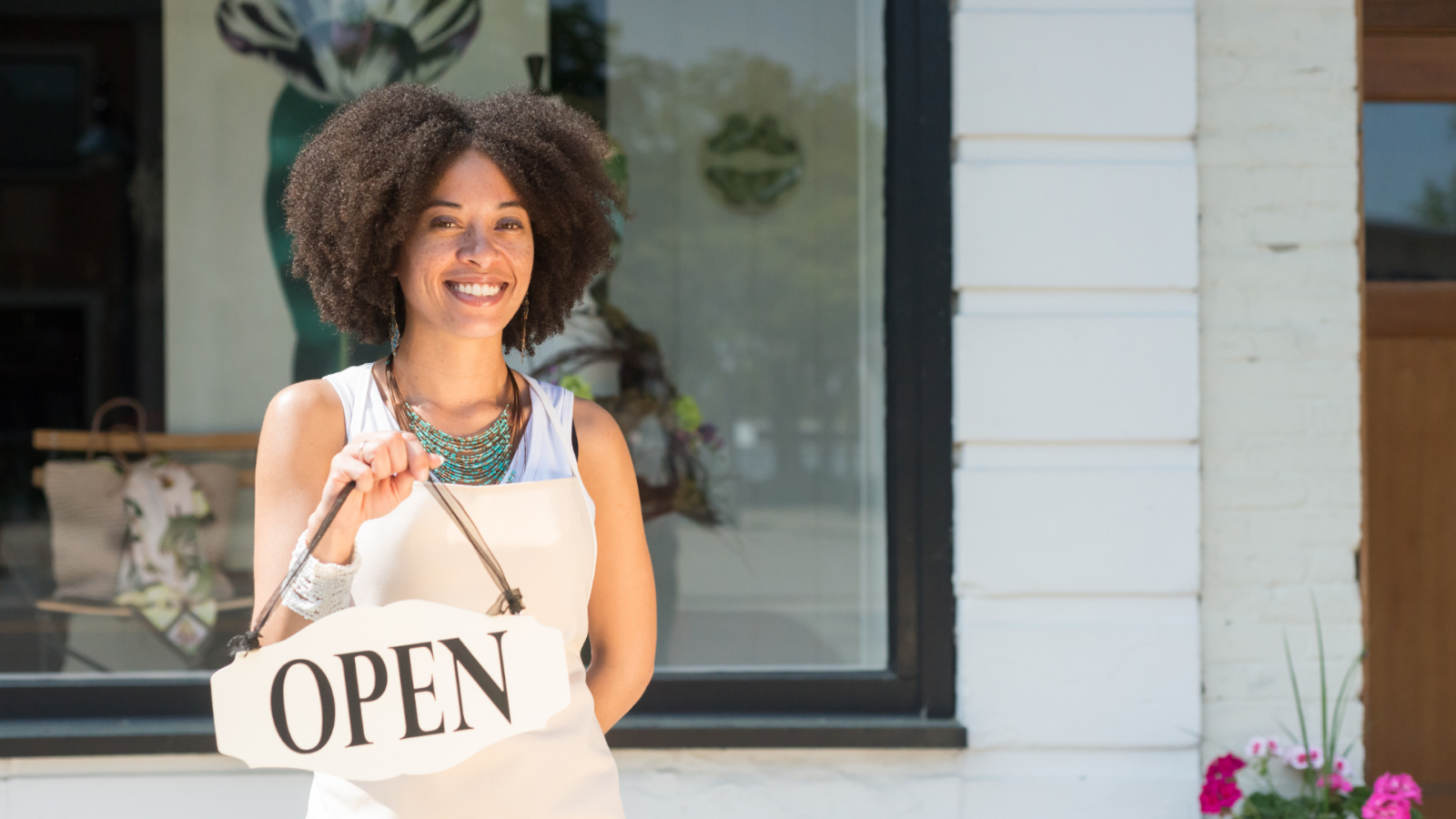 An image of a small business owner who has just set up her Business Number for her new business.